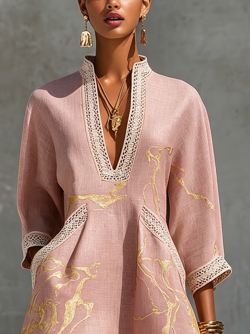 Close-up of Ninon dress deep V-neckline with cream crochet lace trim