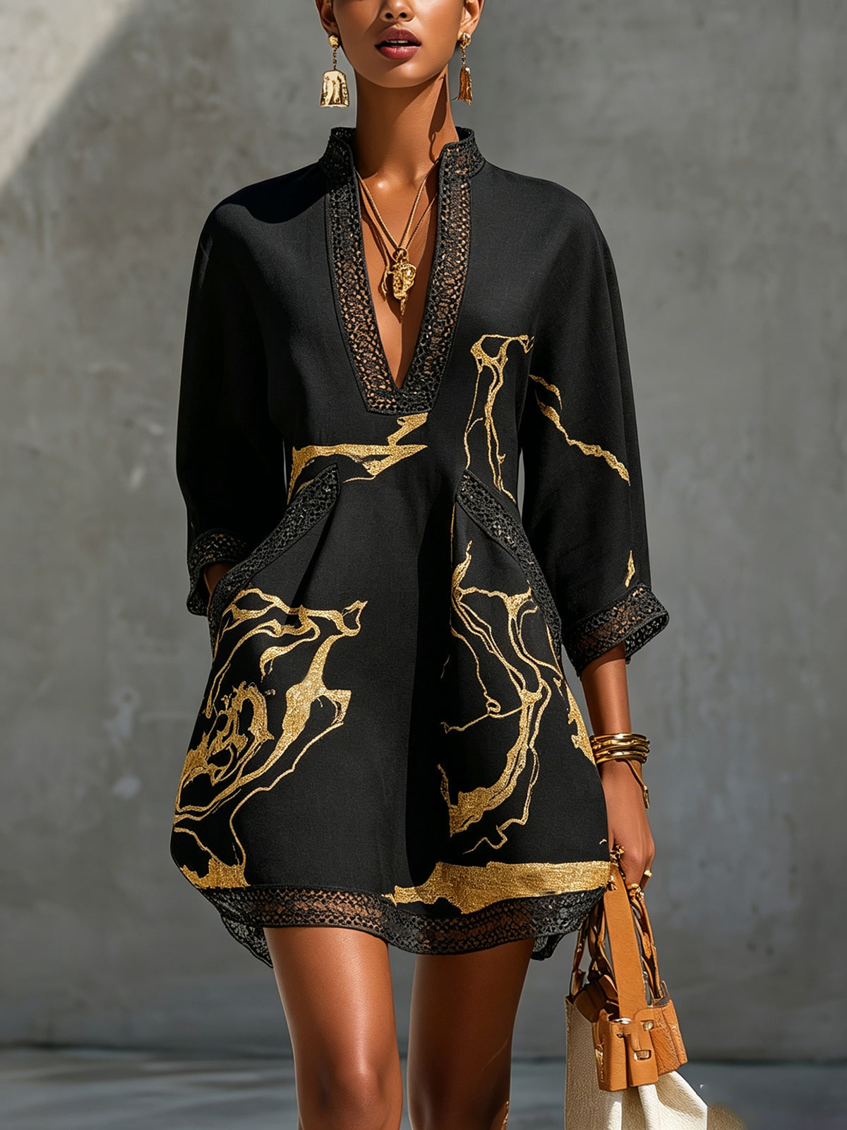 Léonie black crochet lace mini dress with gold print, front view
