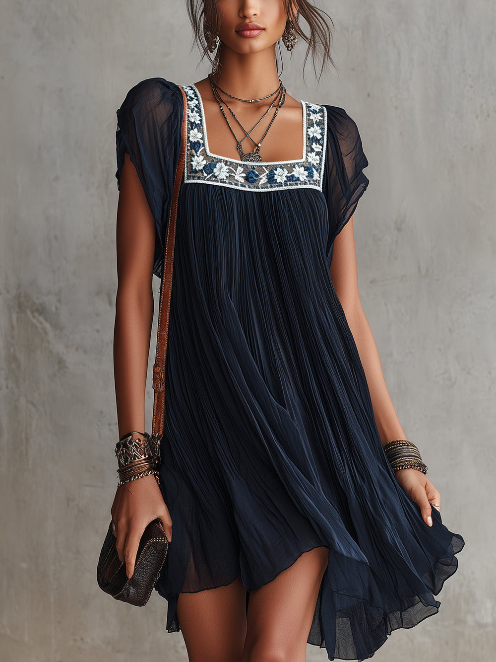 Apolline pleated mini dress in navy, front view with embroidered neckline