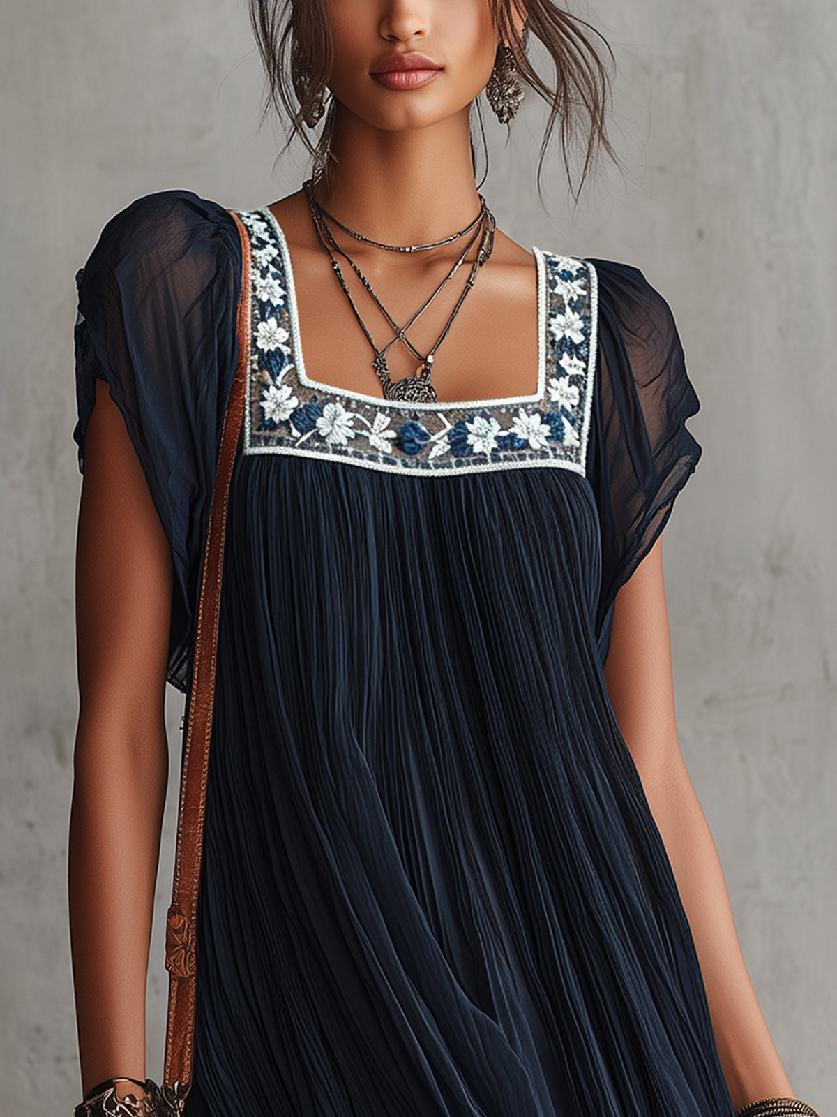 Apolline navy mini dress, close-up of floral embroidered square neckline