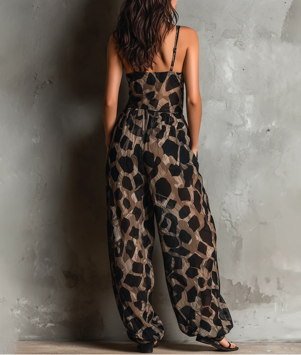 Roberta animal-print jumpsuit in black, back view with thin straps
