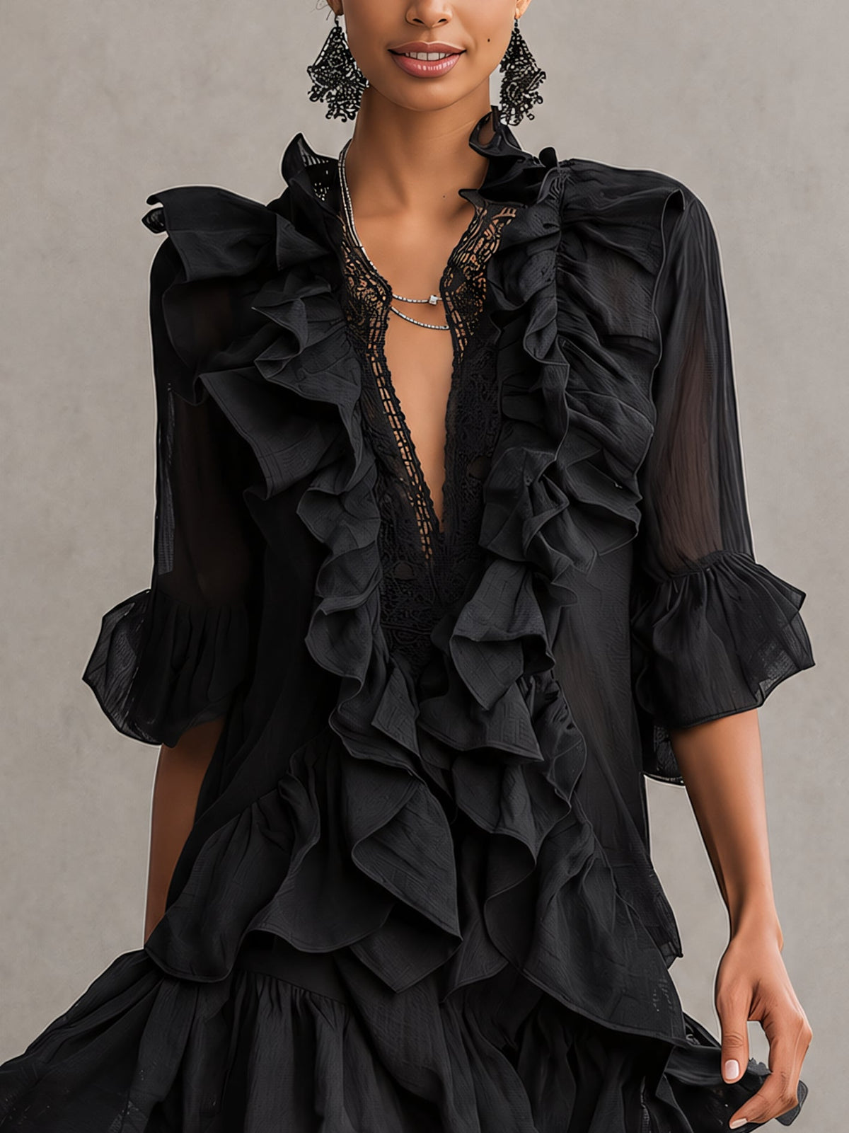 Anaïs black mini dress, close-up of lace neckline and chiffon ruffles