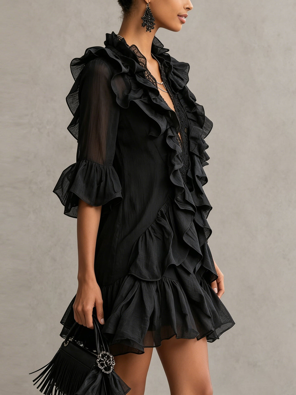 Anaïs ruffle mini dress in black, side view showing tiered hem