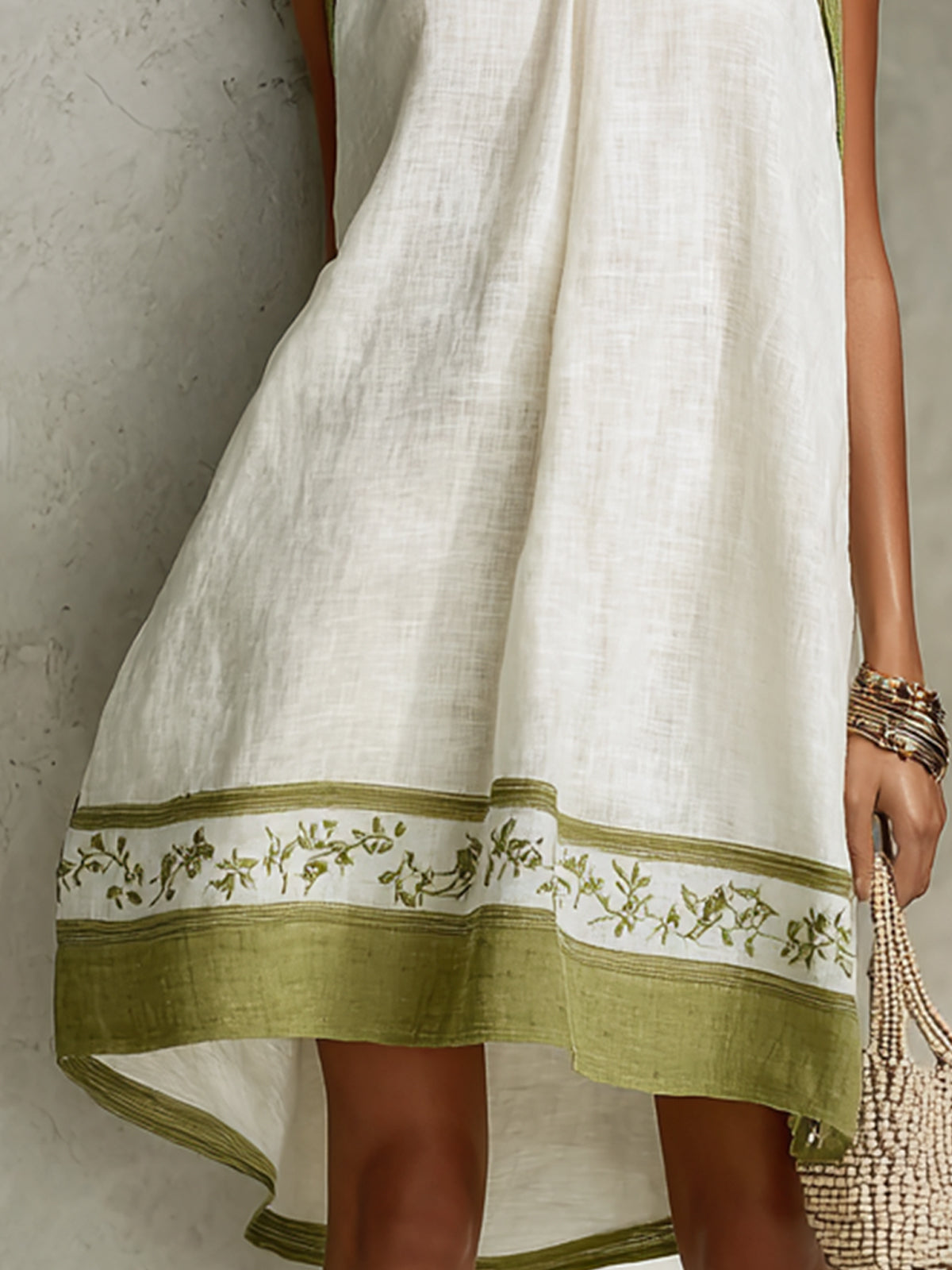 Close-up of Agathe dress olive floral printed hem border