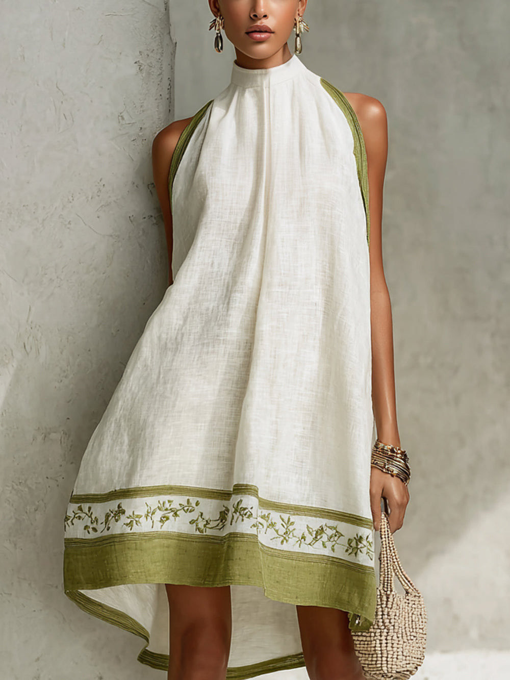 Agathe sleeveless A-line mini dress in white with olive floral border, front view