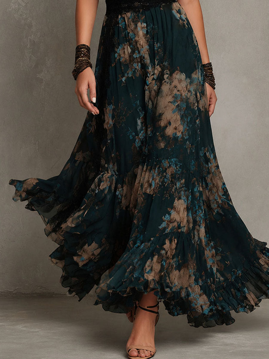 Close-up of Victoria dress ruffled floral skirt in dark teal