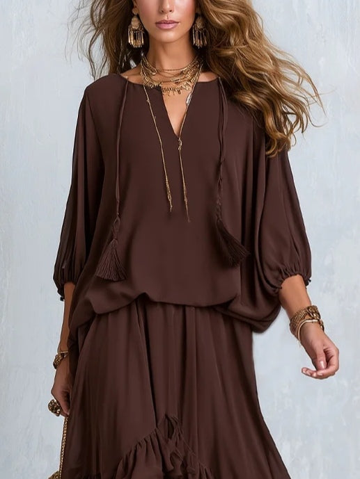 Ondine brown chiffon top close-up showing tassel ties and balloon sleeves