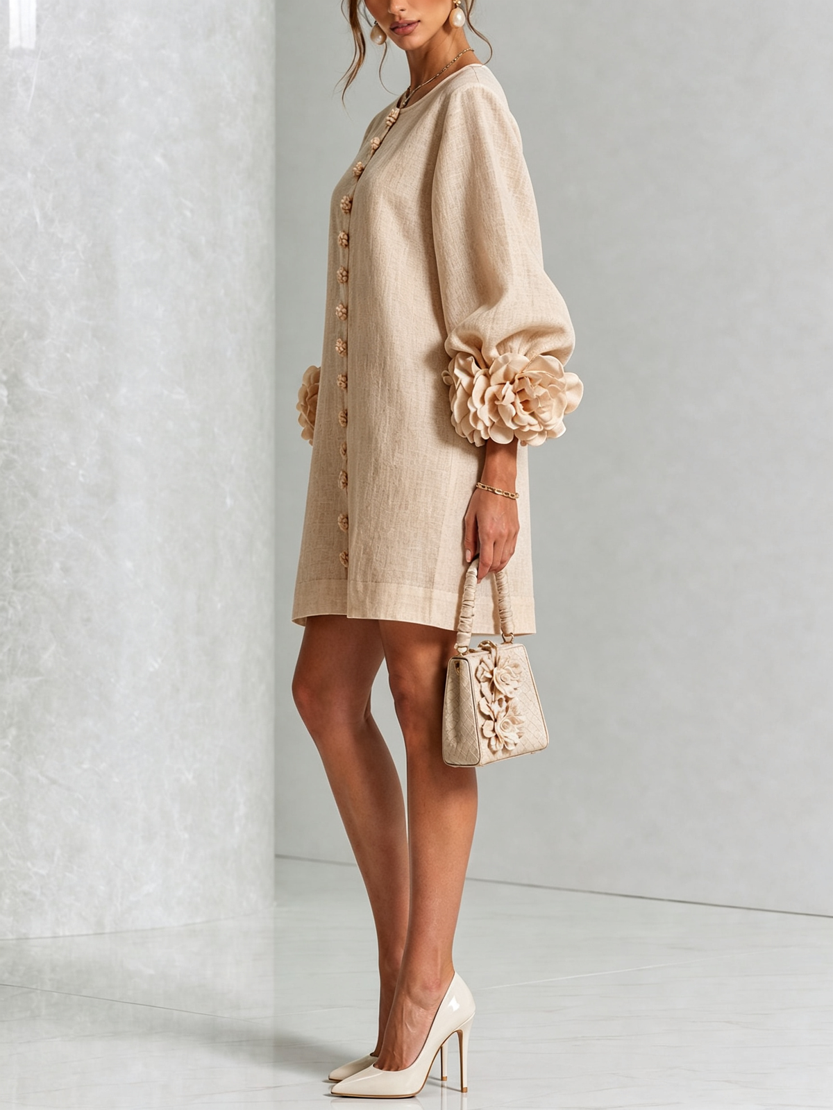 Ambra mini dress in beige, side view with balloon sleeves and rose cuff detail