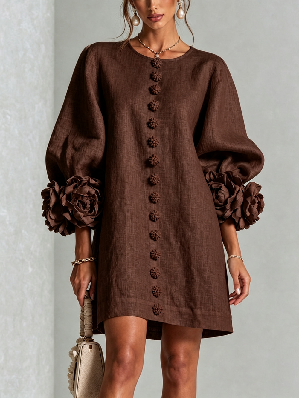 Bruna relaxed mini dress in chocolate brown, front view with floral buttons