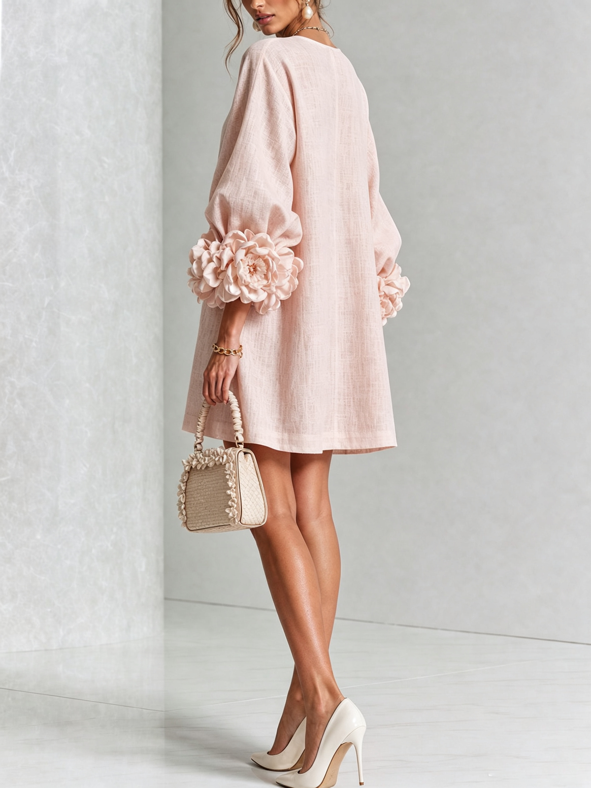 Noemi mini dress in pink, back view with three-quarter sleeves
