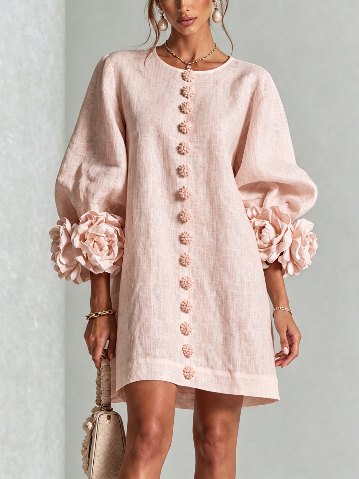Noemi relaxed mini dress in pink, front view with floral buttons