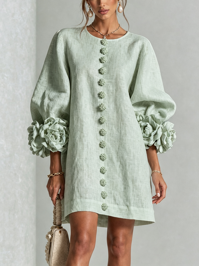 Delia relaxed mini dress in sage green, front view with rose cuffs
