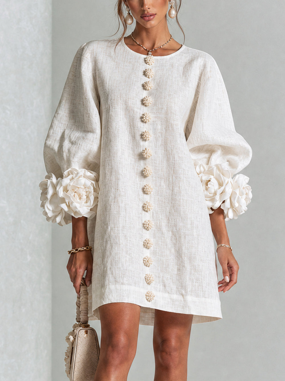 Chiara relaxed mini dress in white, front view with floral buttons