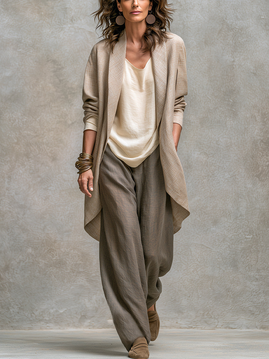 Beige-grey three-piece wide-leg suit, full-length front view with draped jacket
