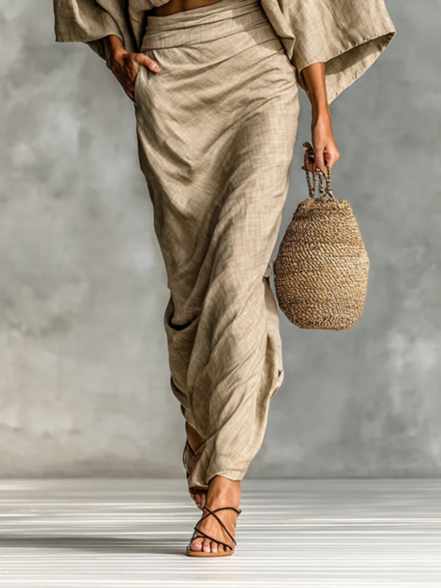 Julia 2-piece set in khaki, detail of long draped skirt and flat sandals