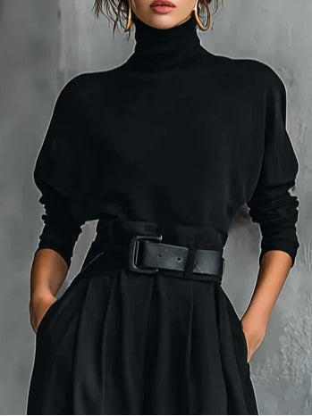Genevieve black turtleneck co-ord set, close-up of high neck and matching belt