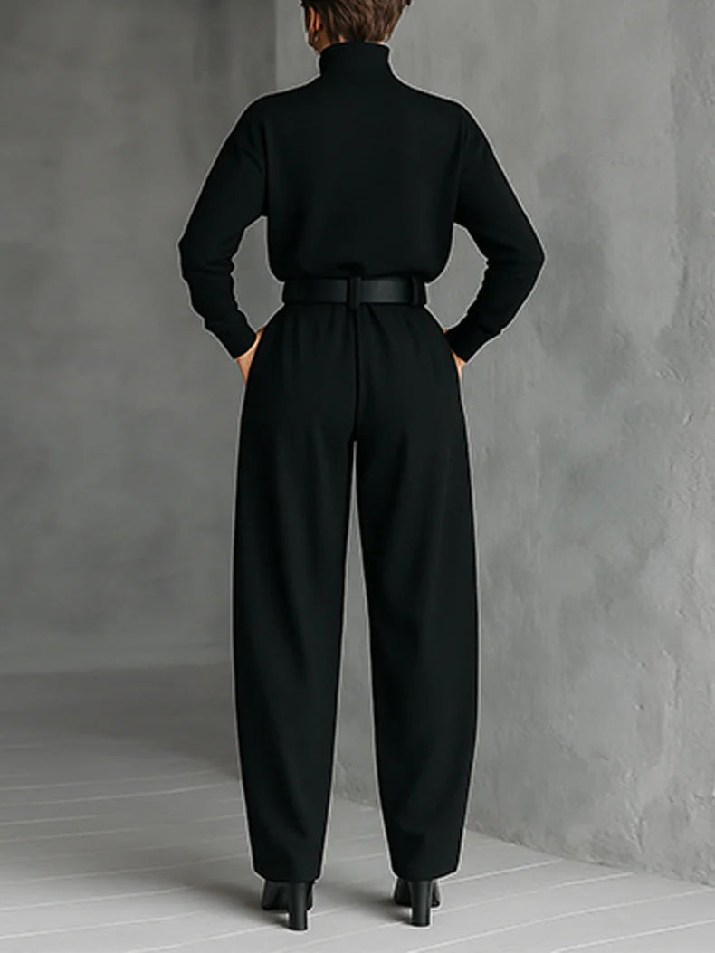 Noëlla turtleneck and trouser set in black, full-length back view