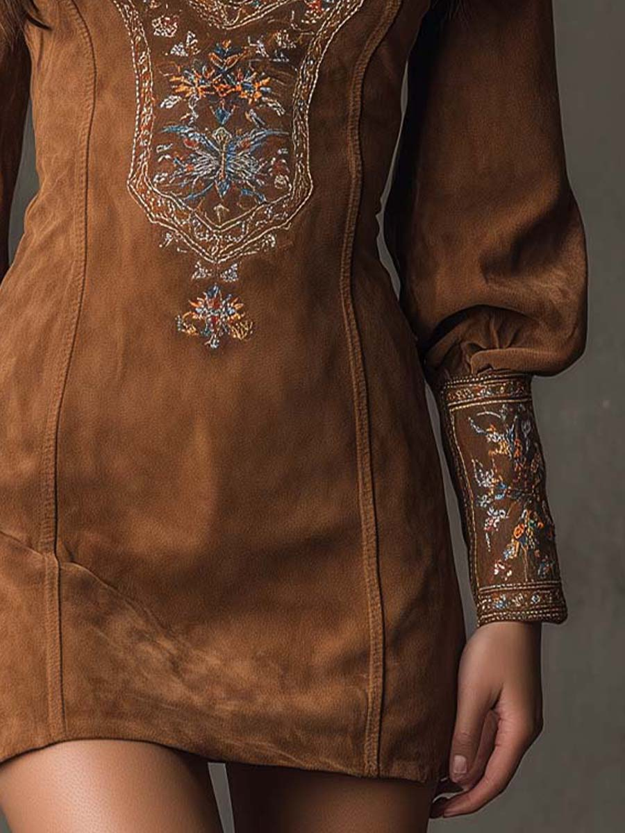 Izolda mini dress in brown, side detail of embroidery and mini length