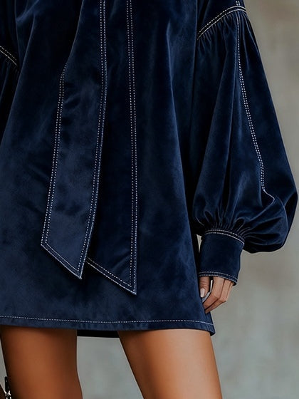 Liora dark blue velvet mini dress, close-up of hem and sleeve cuff