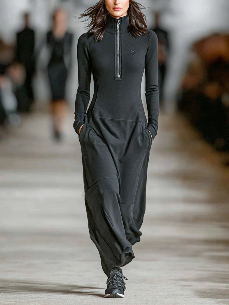 Luna turtleneck zip-up maxi dress in black, full-length front view with trainers