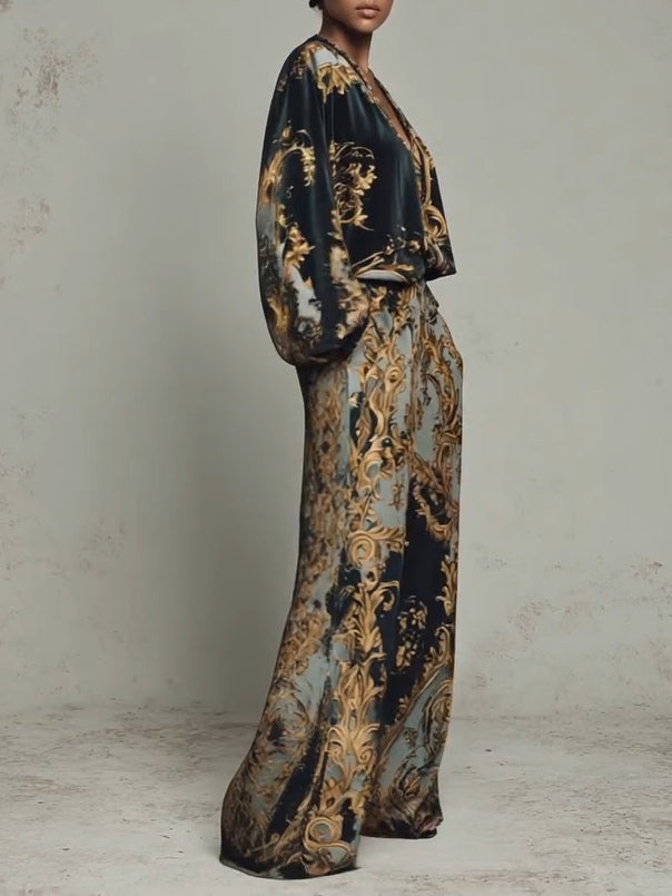 Isabella baroque print suit in black and gold, side view showing draped sleeves