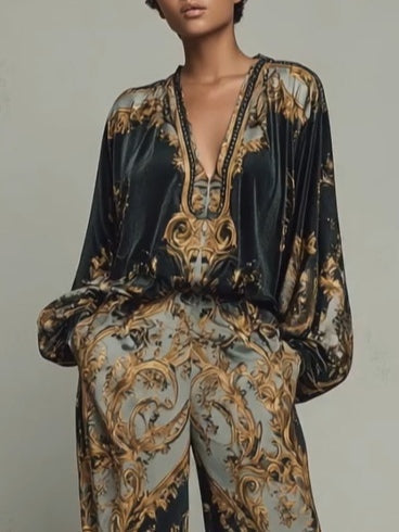 Isabella velvet top close-up showing deep V neckline with braided trim