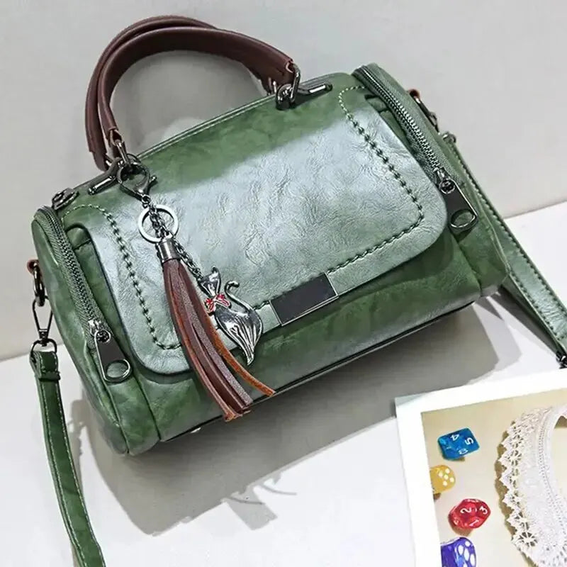 Eliana leather shoulder bag in green, angled front view