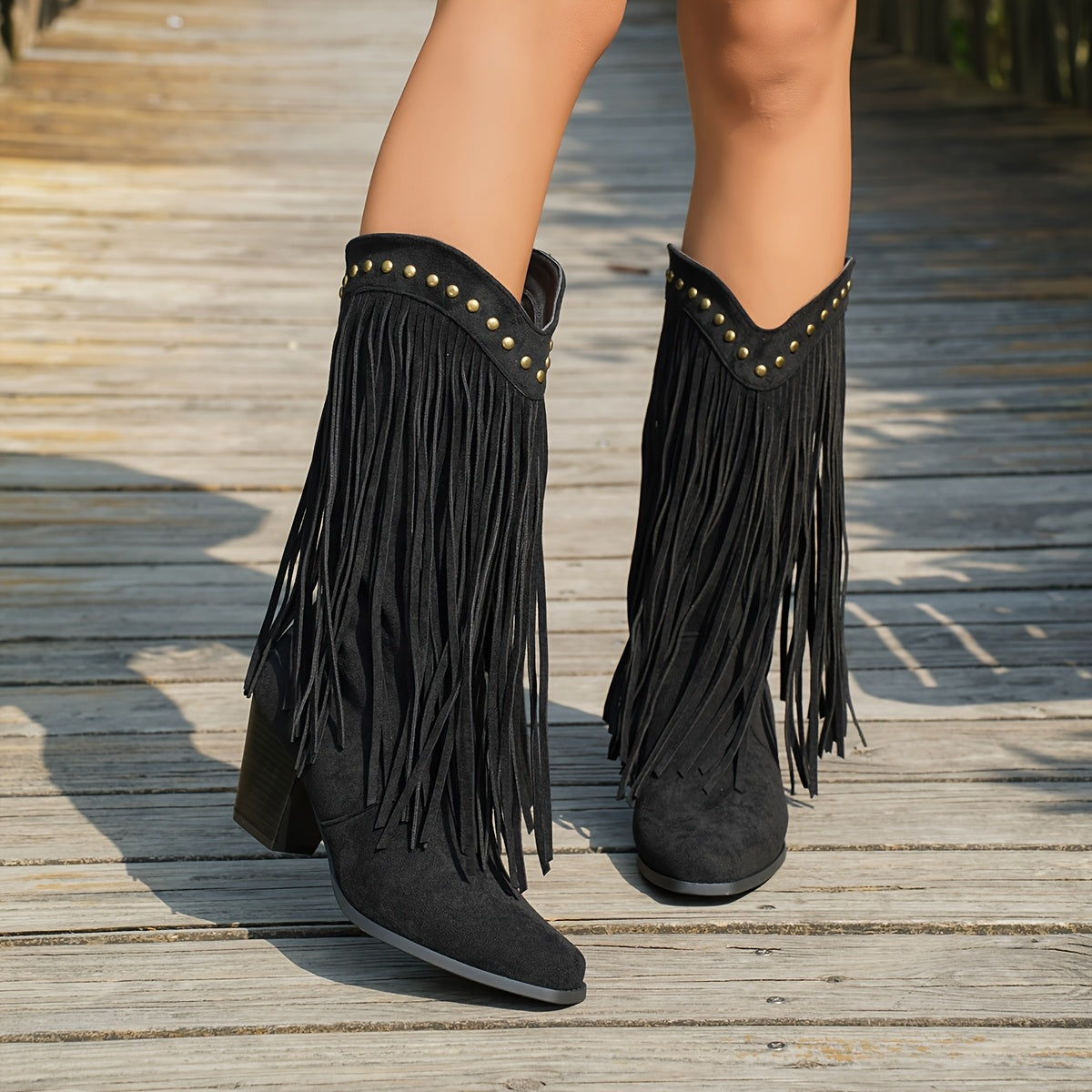 Vespa fringe western boots in black, close view of studs and block heel