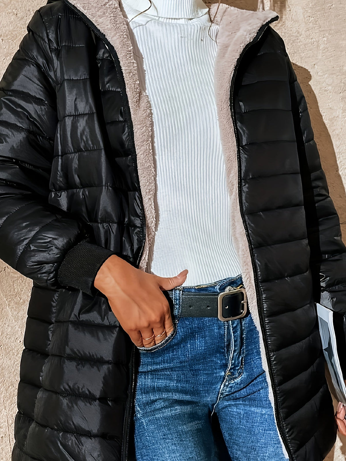 Lunera quilted jacket in black, close-up of open zip front and pocket