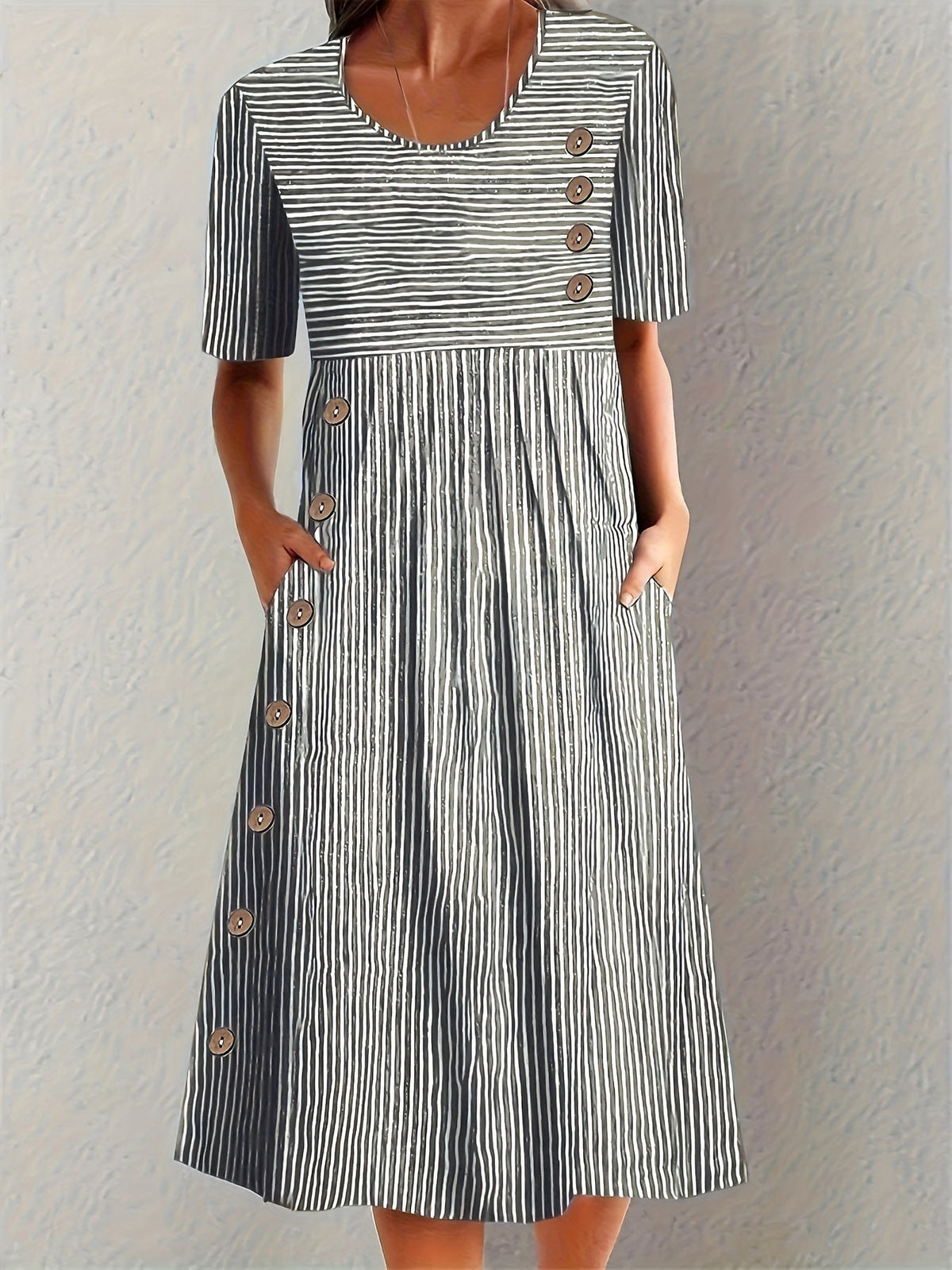 Sofia striped summer dress in black and white, front view with button detail