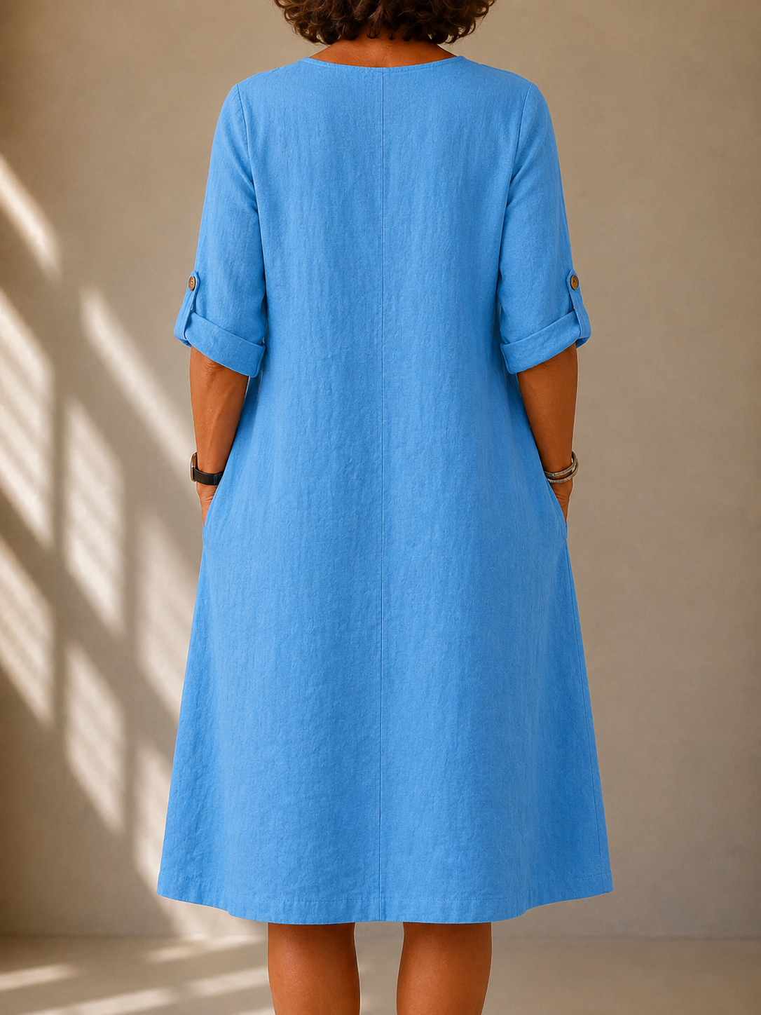Claire casual V-neck dress in bright blue, back view