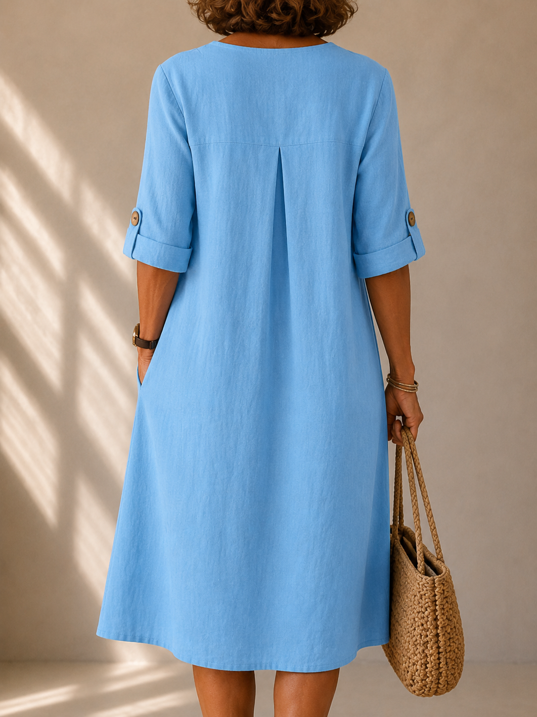 Marie buttoned adjustable-sleeve dress in sky blue, back view with box pleat
