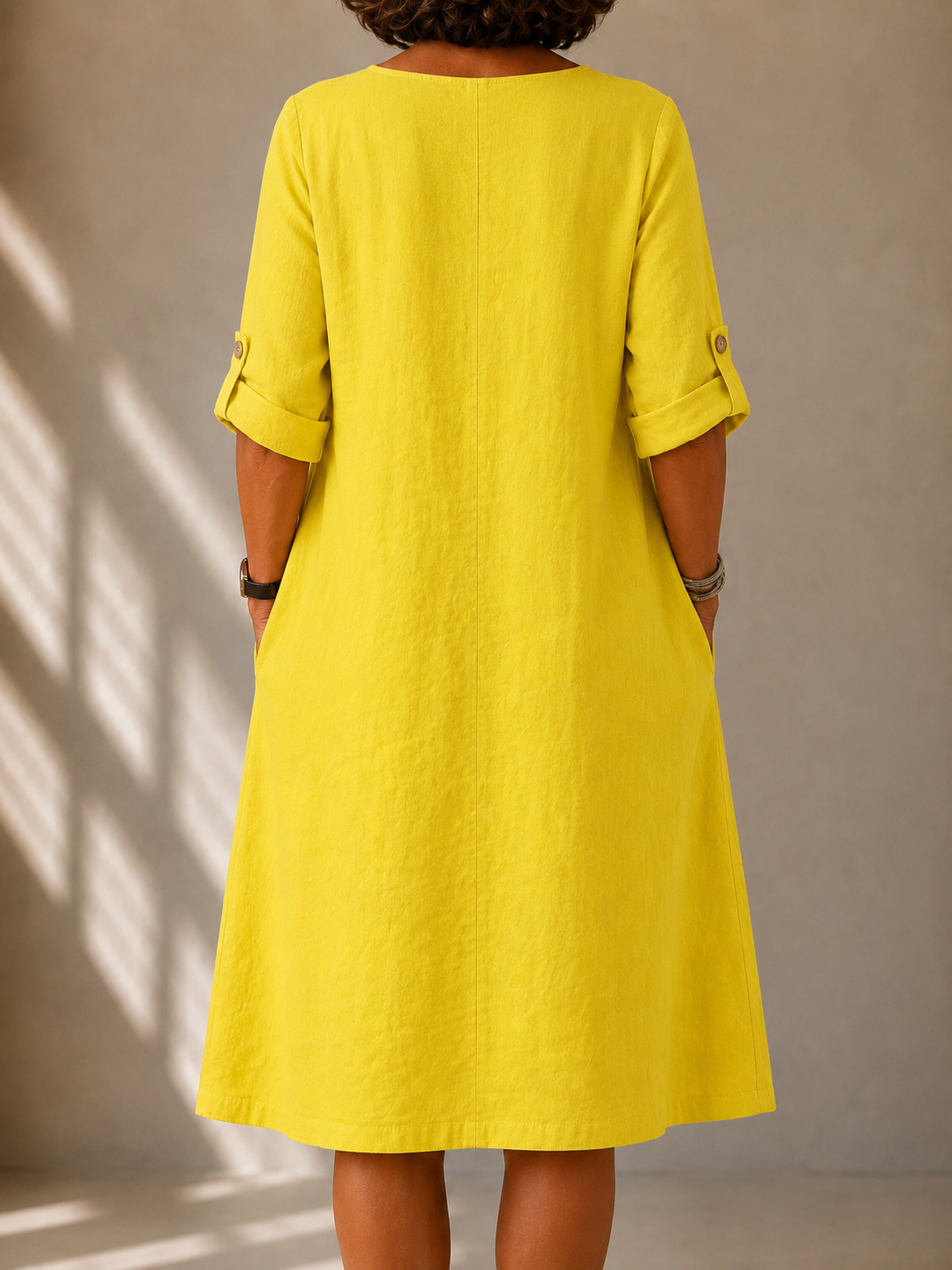 Sylvie flowy V-neck dress in bright yellow, back view