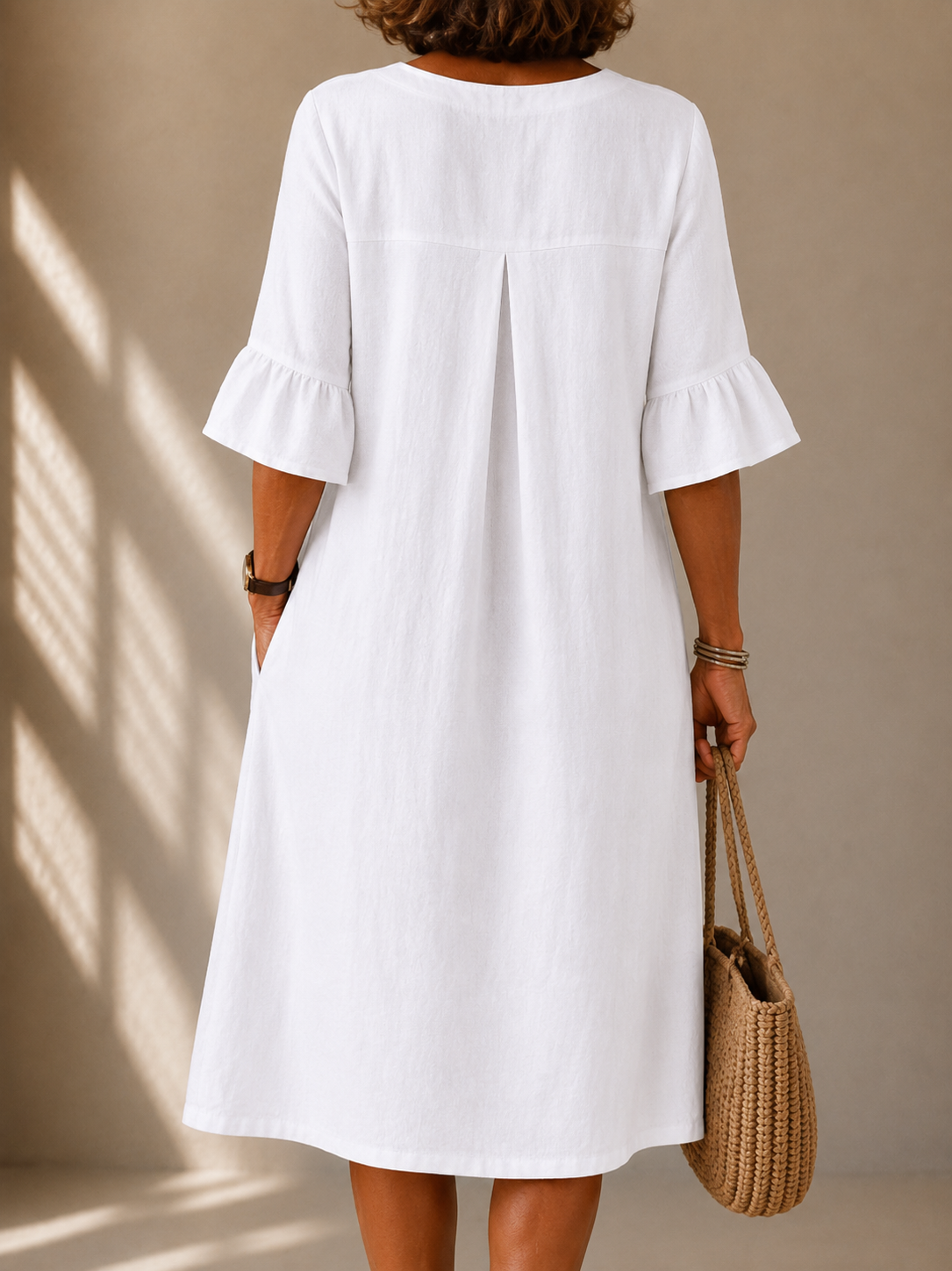 Nicole buttoned bell-sleeve dress in white, back view with box pleat