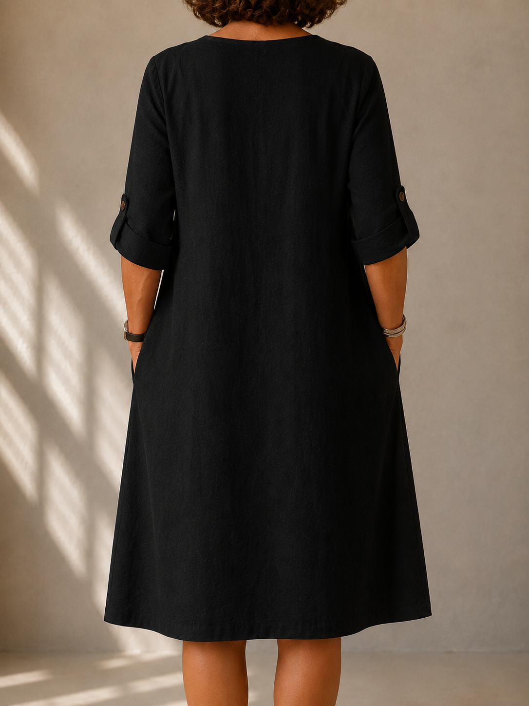 Pauline straight-cut roll-up sleeve dress in black, back view