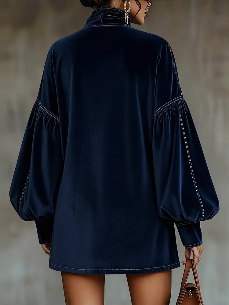 Liora velvet mini dress in dark blue, back view with lantern sleeves