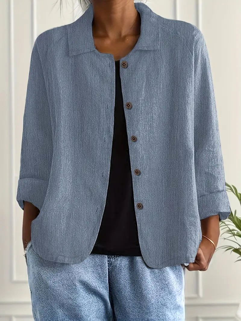 Wilhelmine relaxed button-front blouse in blue, worn open over a black tee, front view