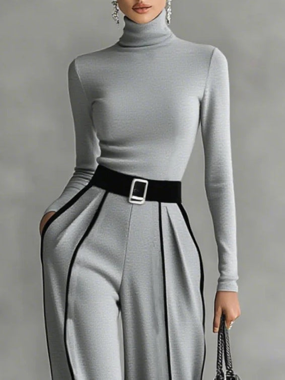 Adèle set in grey, close-up of high neckline and black belt