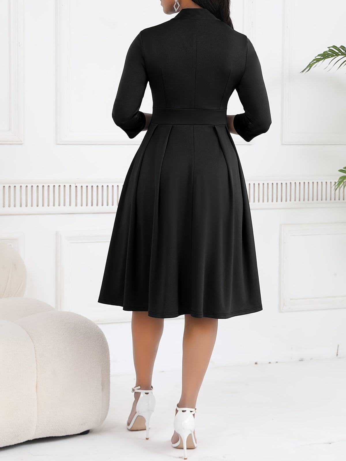 Olivia tie-waist midi dress in black, back view of pleated skirt