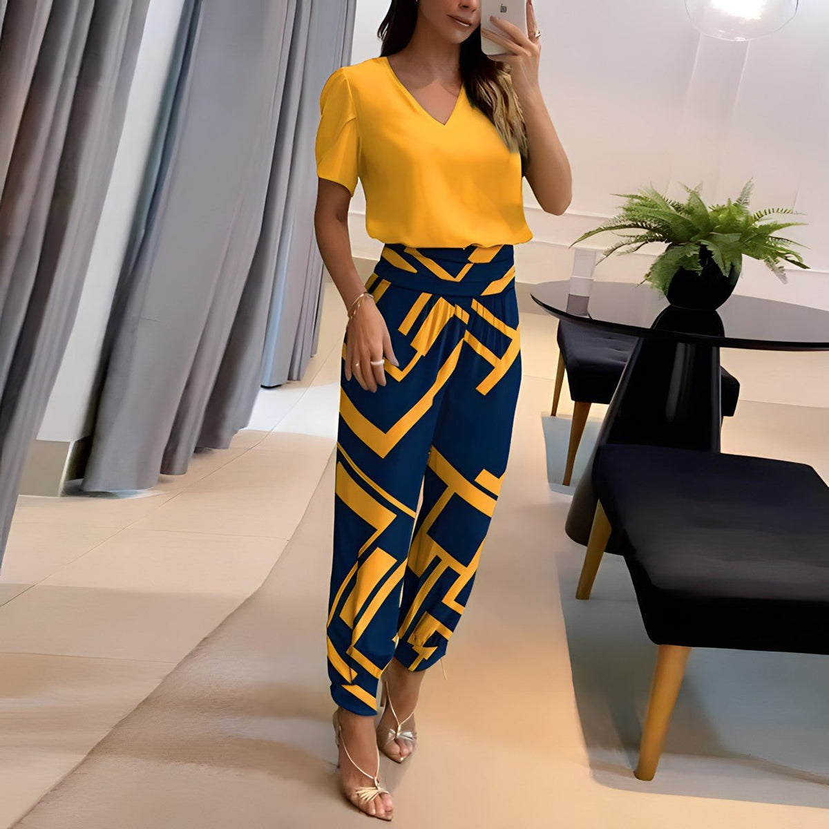 Vivienne two-piece set with yellow blouse and blue geometric print trousers, full-length view