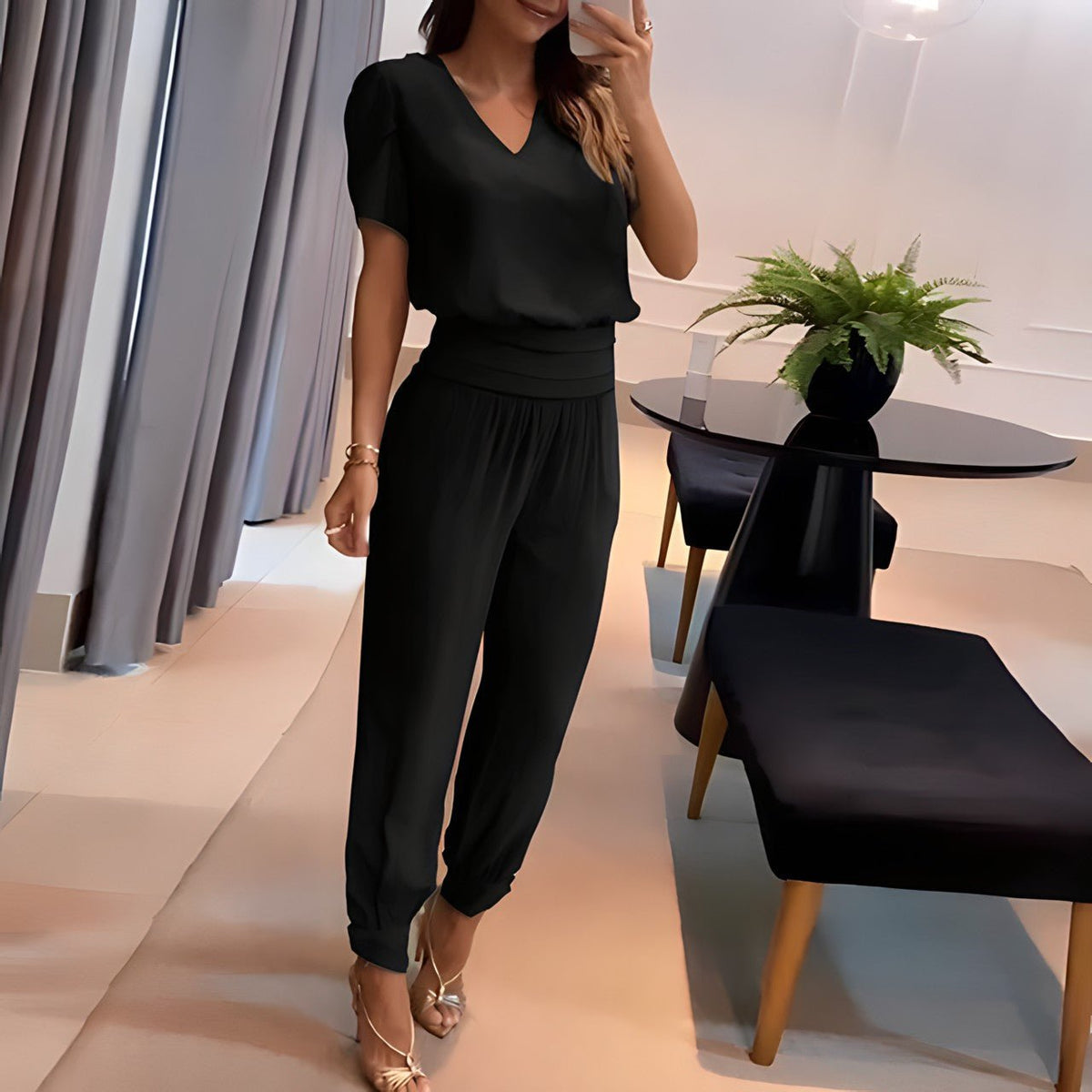 Vivienne two-piece set in black, puff-sleeve blouse and cuffed trousers, full-length view