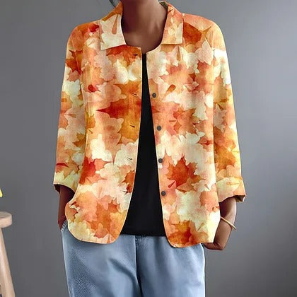 Laurentine printed blouse in orange, relaxed hip-length layer over dark top