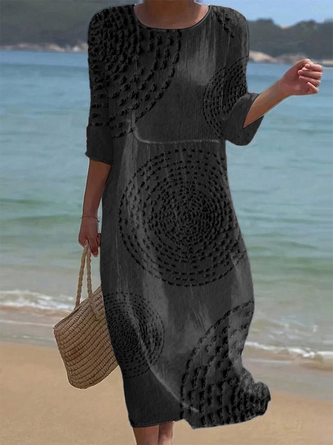 Textured casual midi dress in black, full-length front view on the beach