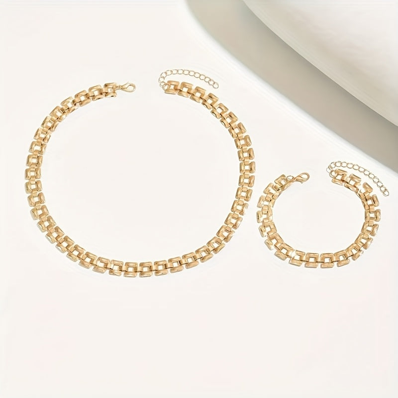 Gold square buckle necklace and bracelet laid flat with extender chains