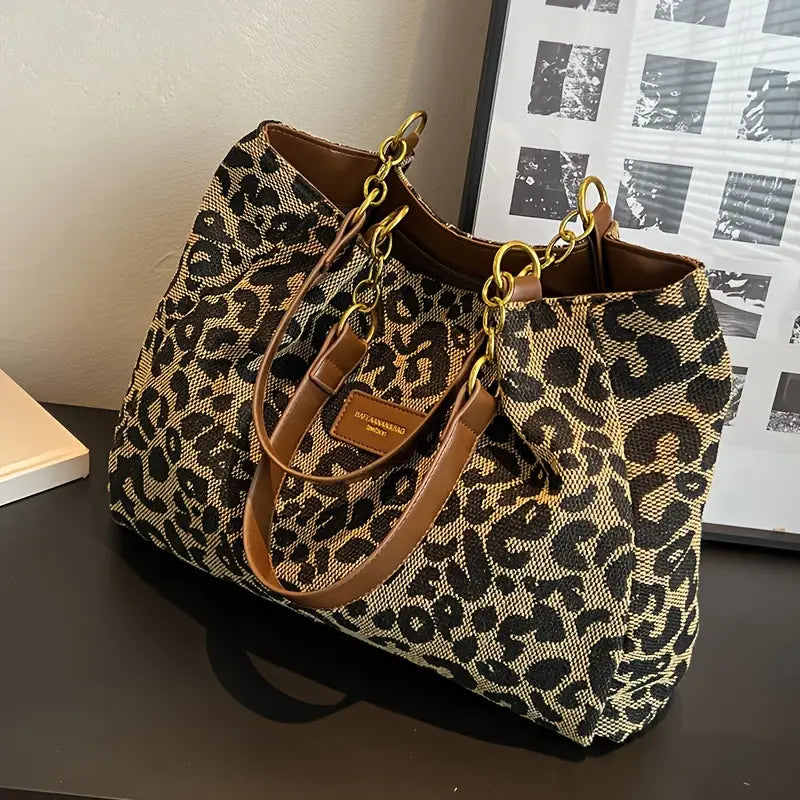Classic leopard tote bag with gold chain-link straps, side view