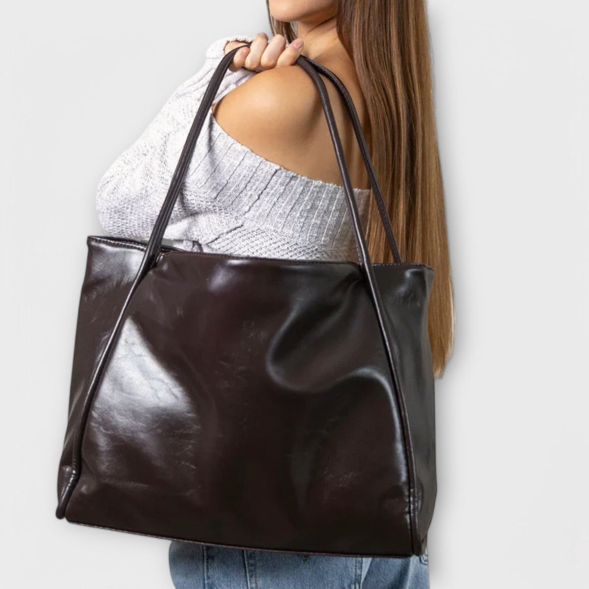 Valerie Blair tote bag in dark brown carried on the shoulder
