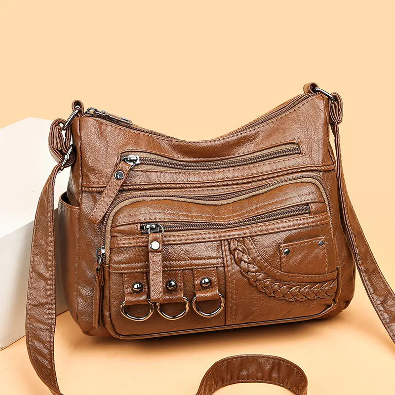 Olivia brown shoulder bag showing zipped front compartments