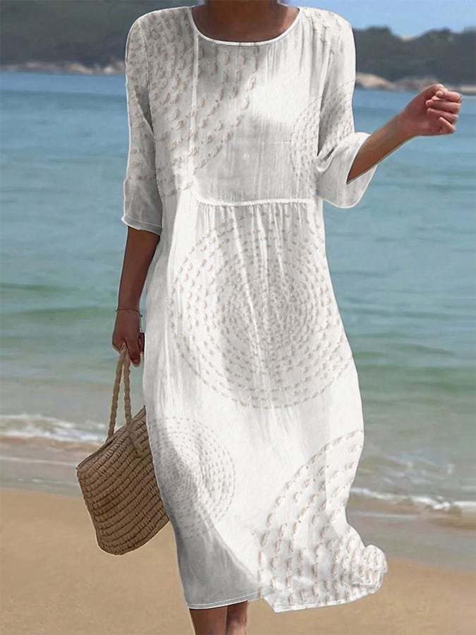 White embroidered casual midi dress, full-length front view on the beach