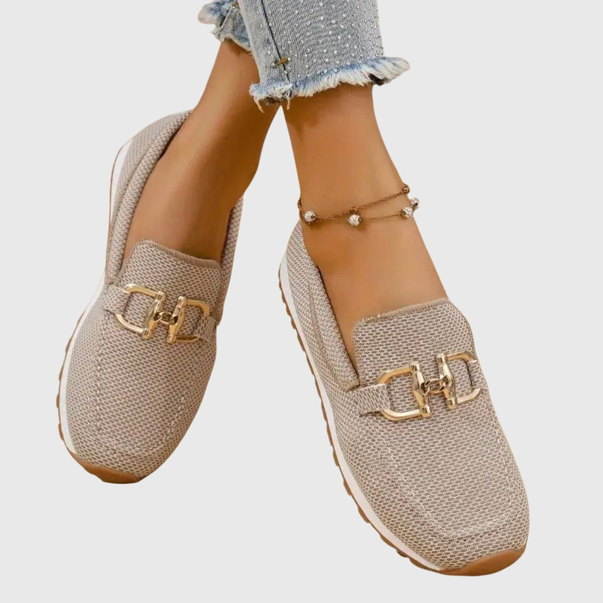 Winifred loafers in beige, side view on model with cropped jeans
