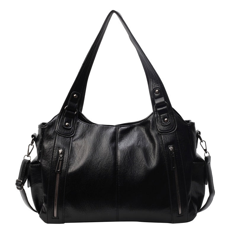 Rae classic handbag in black, front view with front zips